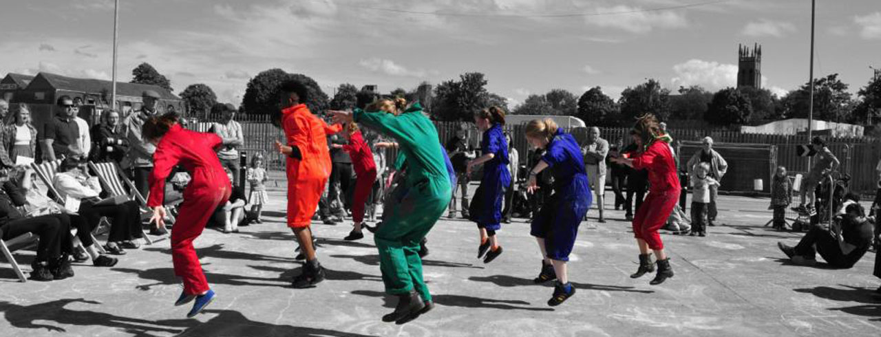 Performers dancing in outdoor community project with Bristol Old Vic