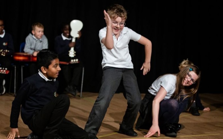 Pupils performing in 'The Nile and the Amazon' in 2022.