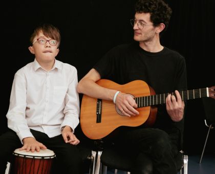 A member of Louder Than Words performs with a facilitator during our youth theatre sharing.