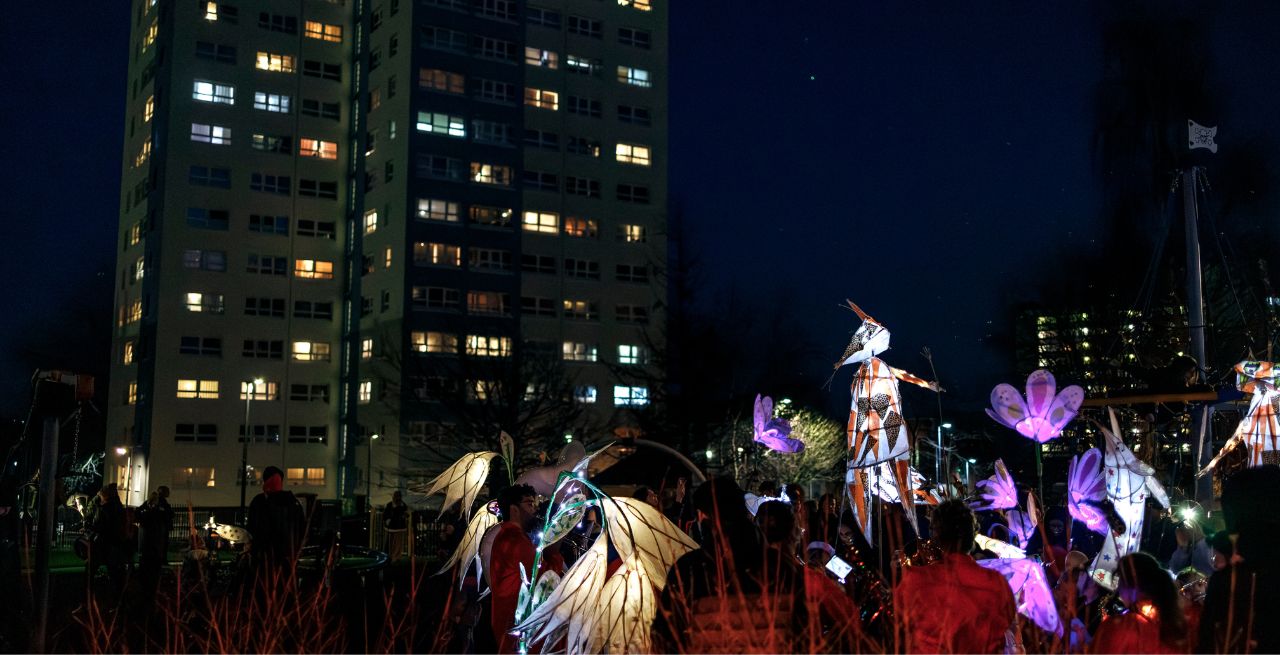 A photo from Winter Lights - the lantern parade in front of the Barton Hill flats in the Urban Park, Barton Hill.