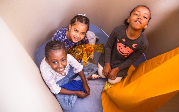 Children enjoying a free creative workshop at Travelling Light.