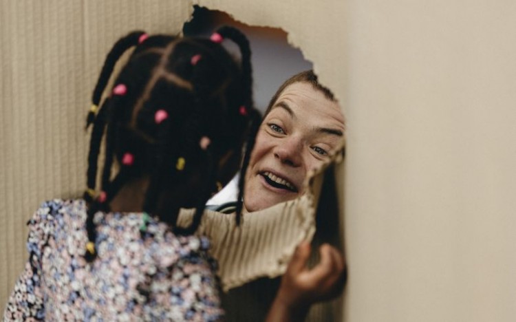 An artist and child taking part in creative play during R&D for a new early years show.