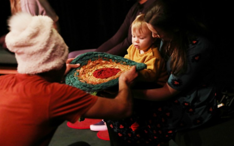 Alex Stedman with a young theatregoer during Igloo.