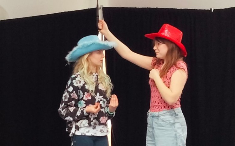 Members of our 11-13's performing in 'Outsiders'.